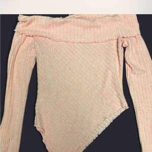 Off shoulder pink ribbed top with long sleeves. Perfect for a night out !